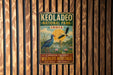A vintage-style metal sign for Keoladeo National Park in India, featuring an illustration of birds and a scenic landscape.