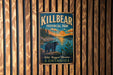 A vintage-style metal sign for Killbear Provincial Park in Ontario, featuring a bear and a scenic landscape.