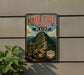 A vintage metal sign for Knife Edge Trail in Maine, featuring a mountain landscape and trail information.