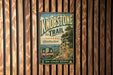 A vintage-style metal sign for Knobstone Trail in Indiana, featuring a scenic mountain landscape and hiking trail information.