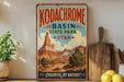 A vintage-style sign for Kodachrome Basin State Park in Utah, featuring a colorful illustration of the park's landscape.