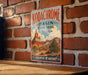 A vintage-style sign for Kodachrome Basin State Park in Utah, featuring a scenic image of the park's natural landscape.