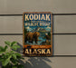 A vintage-style metal sign for the Kodiak National Wildlife Refuge in Alaska, featuring a bear and an eagle in a scenic landscape.