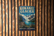 A vintage metal sign for the KokANEEE Glacier Provincial Park in British Columbia, Canada, featuring a scenic mountain landscape.