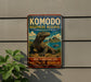 a sign for Komodo Island, Indonesia, which is a World Heritage Site. The sign displays a large illustration of a Komodo lizard and includes text that describes the island as a "World Heritage Site" and a "Protected Nature Area".