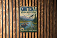 A vintage metal sign for the Kootenai National Wildlife Refuge in Idaho, featuring an illustration of moose, eagle, and other wildlife in a scenic landscape.