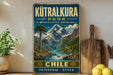 A vintage-style sign for the park of Chile, featuring a mountain landscape with a river and pine trees.