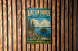 A vintage metal sign for Lac La Ronge Provincial Park in Saskatchewan, featuring a scenic landscape with pine trees, a lake, and a small island.