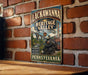 A vintage-style sign for the Lackawanna Heritage Valley National Heritage Area in Pennsylvania, featuring an illustration of a train and a bridge.