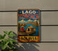 A vintage-style metal sign with the text "LAGO TITICACA BOLIVIA" and an illustration of a person in a boat on a body of water.