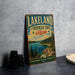 A vintage-style metal sign for Lakeland Provincial Park, Alberta, featuring a scenic landscape with pine trees, a lake, and mountains.