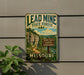 A vintage-style metal sign for the Lead Mine State Forest in Missouri, featuring a scenic landscape with a trail and camping sign.