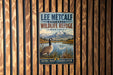 A vintage metal sign for the Lee Metcalf National Wildlife Refuge in Montana, featuring a goose and a mountain landscape.