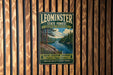 A vintage-style metal sign for Leominster State Forest in Massachusetts, featuring a scenic landscape with pine trees, a river, and a cloudy sky.