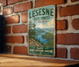 A vintage-style metal sign for LESNESE STATE FOREST, Virginia, mounted on a brick wall.