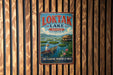 A vintage-style sign for "Loktak Lake" in India, featuring a boat on the water and a person in traditional clothing.