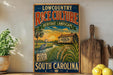A vintage-style sign advertising Lowcountry Rice Culture, featuring a scenic landscape with a house, palm trees, and a bird, along with text promoting the rice as a product of South Carolina.