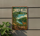A vintage-style sign for Lowden-Miller State Forest in Illinois, featuring a scenic landscape with a deer in the foreground.