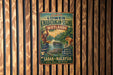 a vintage metal sign advertising a wildlife reserve, specifically the Kinabatangan- Segama Wetlands, in Sabah, Malaysia.