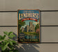 A vintage-style metal sign welcoming visitors to Lyndhurst, New York, with a castle illustration and the text "The Empire State" below.