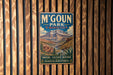 A vintage metal sign for M'Goun Park in Morocco, featuring a mountain landscape and text promoting the park's nature, culture, and heritage.