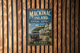 A vintage metal sign for Mackinac Island Historic District, featuring an illustration of a horse-drawn carriage and the text "Mackinac Island" and "Michigan".