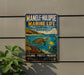 A vintage metal sign for the Manole-Hulopoe Marine Life Conservation District in Hawaii, featuring a colorful illustration of a sea turtle swimming among coral and fish.