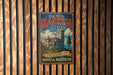 A vintage metal sign for the Manresa Castle in Washington, featuring an illustration of the castle and the text "Manresa Castle" prominently displayed.