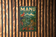 A vintage metal sign for the Manu National Park in Peru, featuring a parrot and a jaguar in a tropical setting.