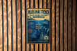 A metal sign with a marine theme, featuring a submarine, coral, and marine life, is displayed on a wooden wall.