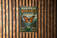 A vintage metal sign with the text "MARIPOSA MONARCA BIOSPHERE RESERVE MEXICO" and an illustration of a butterfly and flowers.
