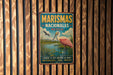 A vintage metal sign with the text "MARISMAS NACIONALES MEXICO" and an illustration of a pink flamingo standing in a pond.