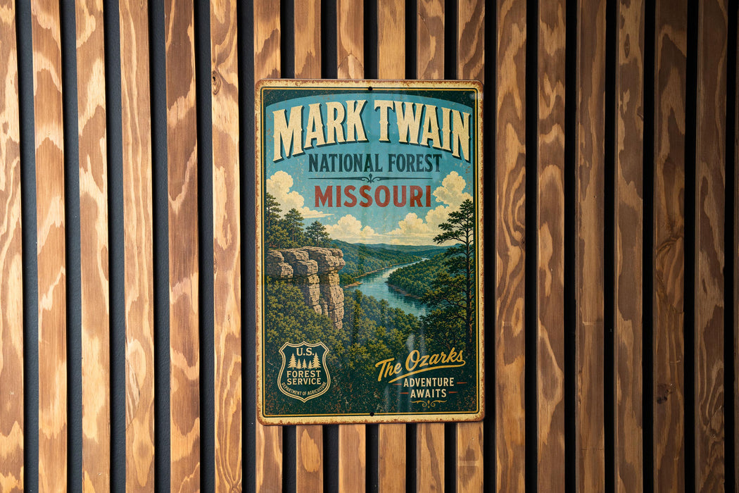 A vintage-style metal sign for the National Forest in Missouri, featuring a scenic landscape with a river and mountains.