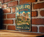 A vintage-style poster advertising the "Marland Mansion" in Oklahoma, featuring a large illustration of a mansion and the text "Step back in time" and "PONCA CITY HISTORIC TREASURE".