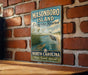 A vintage-style metal sign for Masonboro Island Estuarine Reserve in North Carolina, featuring an illustration of a bird and a turtle in a grassy area with water.
