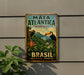 A vintage-style metal sign for the Mata Atlantica Biosphere Reserve in Brazil, featuring a toucan and lush tropical foliage.