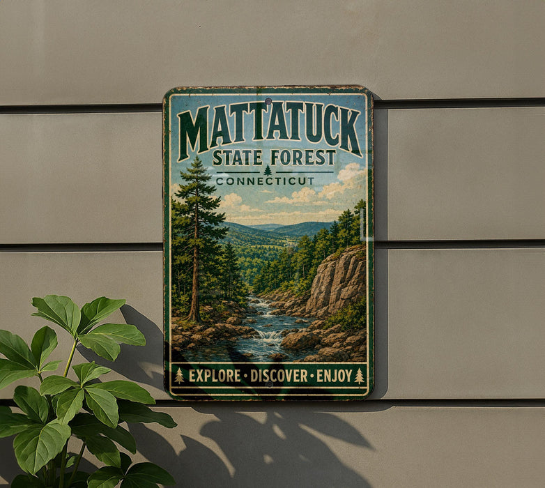 A vintage metal sign for Mattatuck State Forest in Connecticut, featuring a scenic landscape with a river and pine trees.