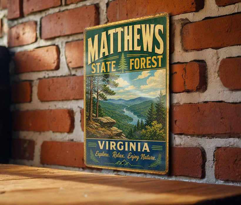 A vintage metal sign for Matthews State Forest in Virginia, featuring a scenic mountain landscape.