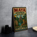 A vintage-style metal sign for the Maya Biosphere Reserve in Guatemala, featuring an illustration of tropical wildlife and landmarks.