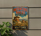 A vintage-style metal sign for Medicine Rocks State Park in Montana, featuring a scenic landscape with rock formations and a blue sky.