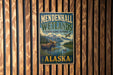 A vintage-style metal sign for Mendenhall Wetlands State Game Refuge in Alaska, featuring a moose and a bird in a scenic landscape.