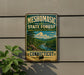 A vintage-style metal sign for the Mesomorphic State Forest in Connecticut, featuring a scenic landscape with a river and forest.
