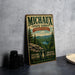 A vintage-style metal sign for the Michaux State Forest in Pennsylvania, featuring a scenic landscape with pine trees, mountains, and a lake.