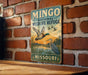 A vintage-style metal sign for the Mingso National Wildlife Refuge in Missouri, featuring an illustration of ducks and a sunset.