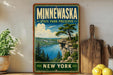 A vintage-style sign for Minnewaska State Park Preserve, featuring a scenic landscape with a cliff overlooking a lake and pine trees.