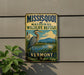 A vintage-style metal sign for the Mississippi National Wildlife Refuge in Vermont, featuring a large heron and a scenic landscape.