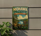 A vintage-style metal sign for Mohawk State Forest in Connecticut, featuring a scenic landscape with pine trees, a lake, and mountains.