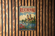 a vintage-style metal sign with the text "MONASTIC ISLAND OF REICHENAU GERMANY" and a picture of a castle on a lake.
