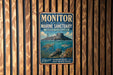 A vintage metal sign for the Monitor National Marine Sanctuary in North Carolina, featuring an illustration of a submarine and marine life.