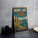 A vintage metal sign for the Mono Lake and Tufa State Natural Reserve in California, featuring a scenic landscape with mountains and a lake.